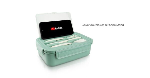 Microwave safe lunch box with compartments, phone holder lid, and utensils- cover doubles as phone stand