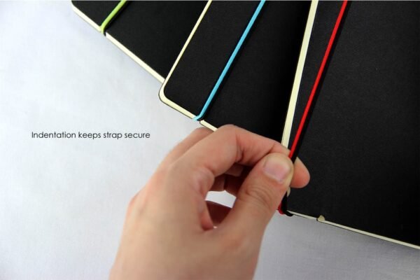 A5 notebook with pen loop and elastic strap in black textured cover- Strap