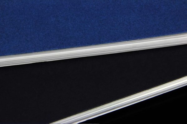 Wire-O notebook with copper binding and lined pages in textured cover- side view